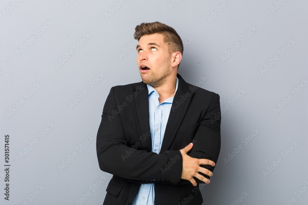 Young handsome caucasian man tired of a repetitive task. Young handsome caucasian man tired of a repetitive task.