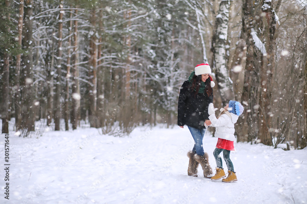 A winter fairy tale in the forest. A girl on a sled with gifts on the eve of the new year in the park. Two sisters walk in a New Year's park and ride a sled with gifts. A winter fairy tale in the forest. A girl on a sled with gifts on the eve of the new year in the park. Two sisters walk in a New Year's park and ride a sled with gifts.