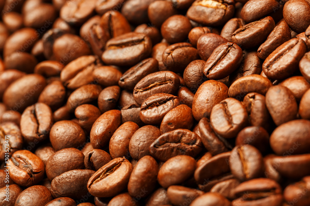 Fototapeta premium Fresh and aromatic roasted coffee beans, can be used as background.