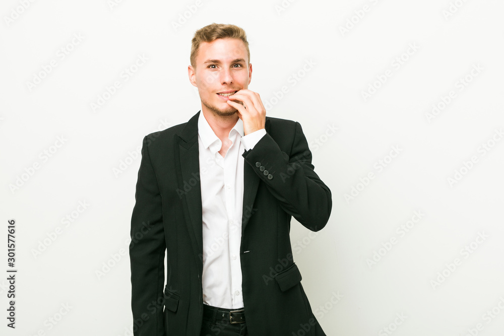 Young caucasian business man biting fingernails, nervous and very anxious. Young caucasian business man biting fingernails, nervous and very anxious.