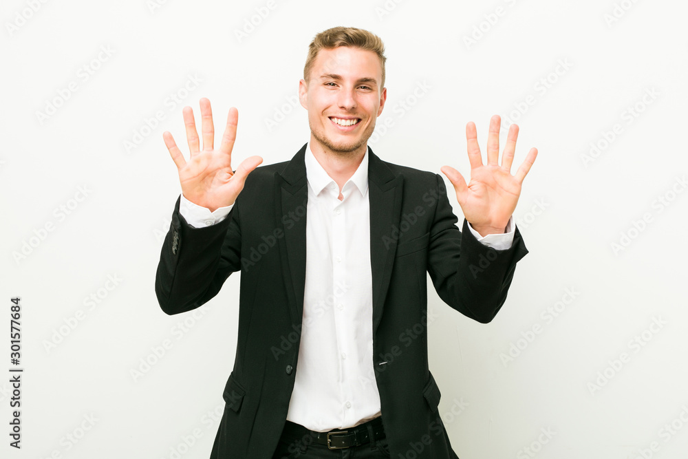 Young caucasian business man showing number ten with hands. Young caucasian business man showing number ten with hands.