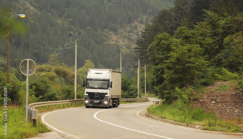 Truck on the road in a sharp curve