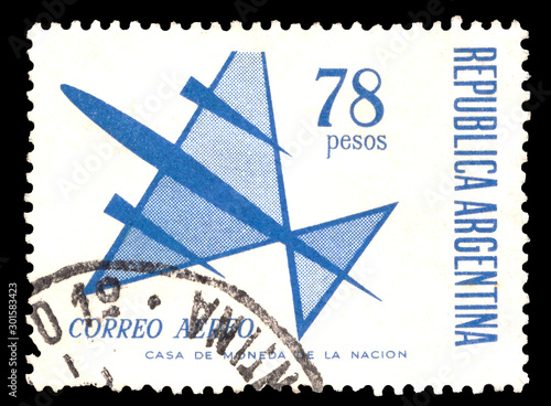 A stamp printed in Argentina  from a series depicting multicolored planes in abstract symbolic form airplane photo