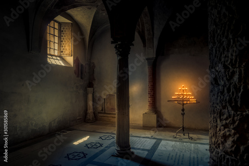 Candle lights in the old church in Florence. Travel destination Tuscany, Italy