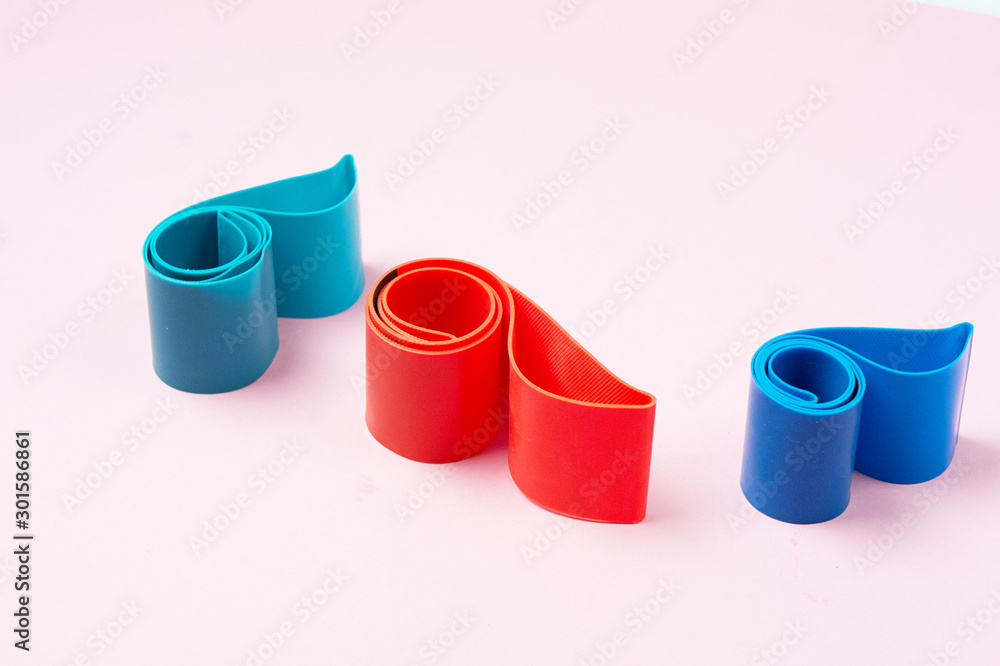 Set of Exercise Bands for Fitness on Pink Background Weight Loss Concept Horizontal Set of Exercise Bands for Fitness on Pink Background Weight Loss Concept Horizontal