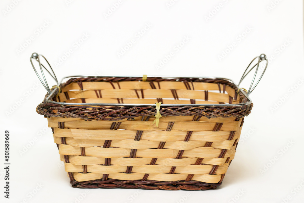 Wicker basket isolated on a white background.