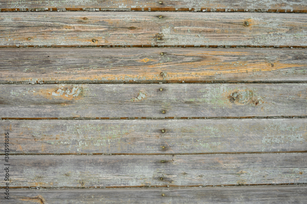 Wood plank wall with peeling paint background texture.