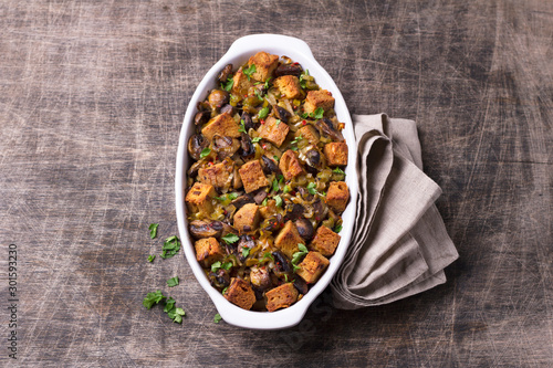 Canvas Print Vegan Stuffing with Mushrooms, Leeks and crunchy croutons on wooden table, top view, horizontal