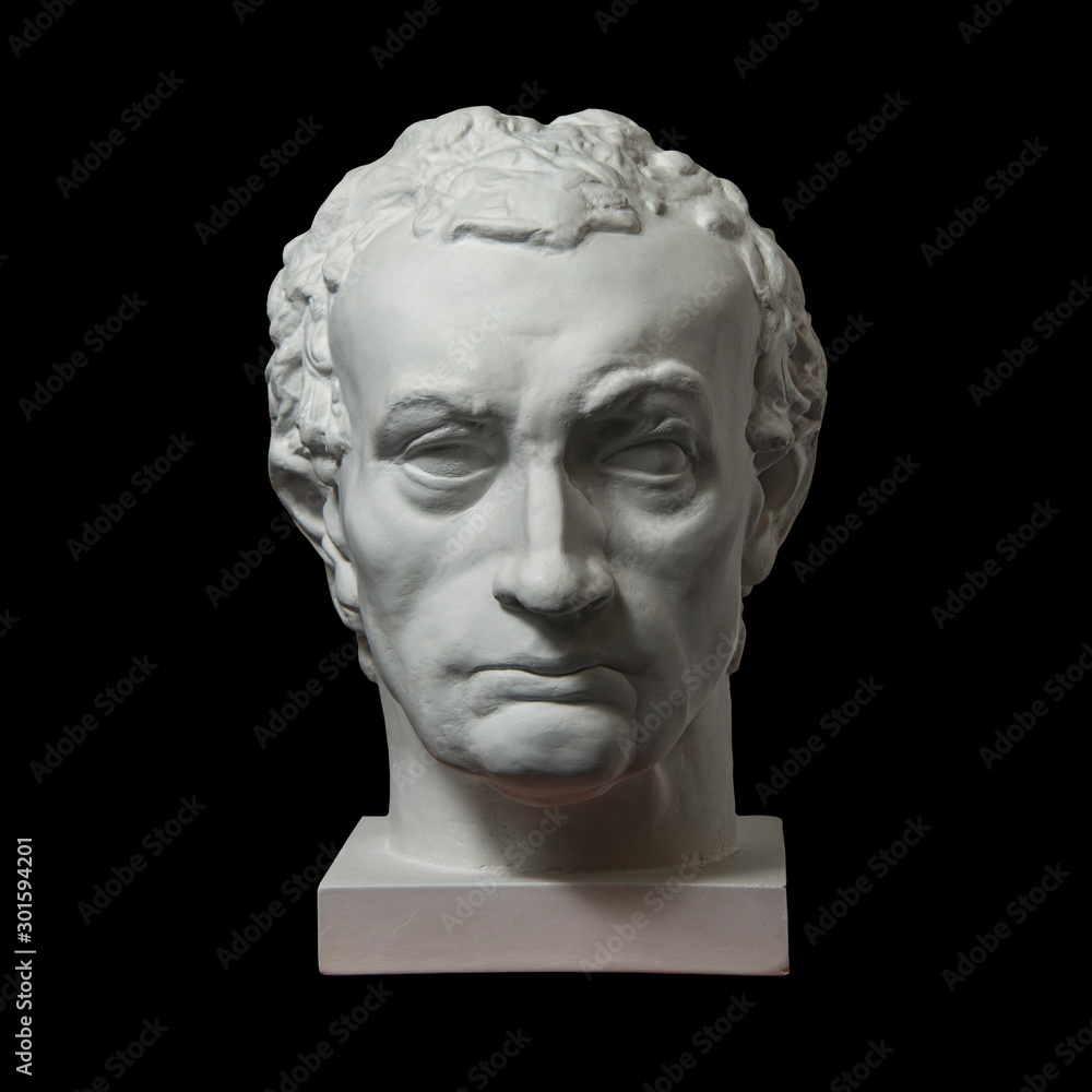 Gypsum copy of ancient statue Gattamelata, Erasmo di Narni, head isolated on black background. Plaster sculpture man face.