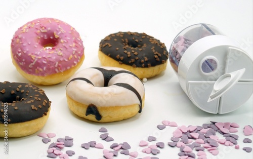 donuts and cup of coffee on wooden table