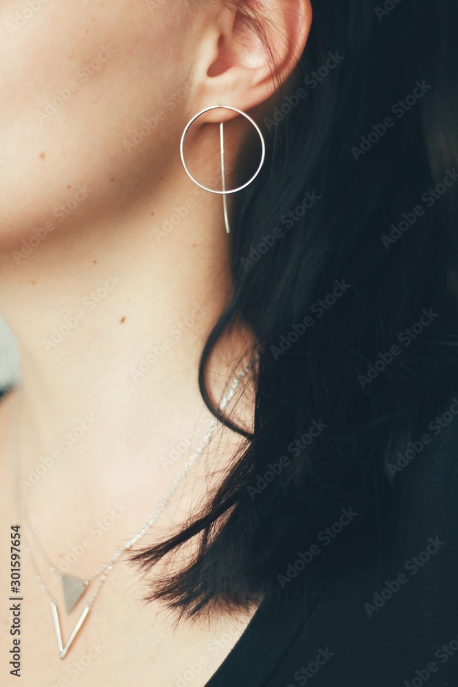 Tender jewerly for female ears, close up shot