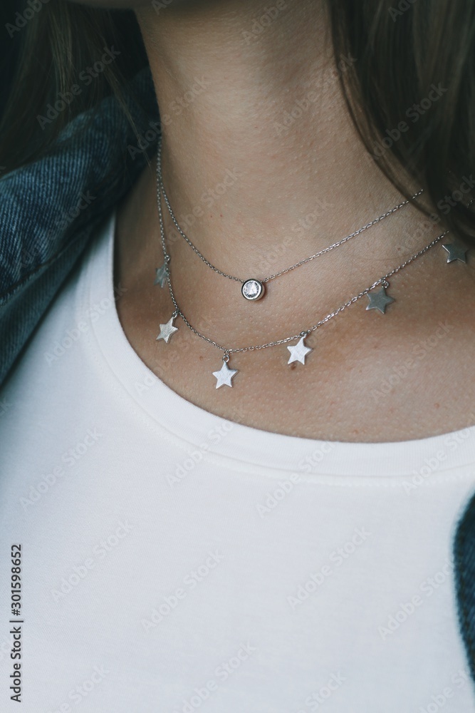 Tender jewerly on female neck, close up shot