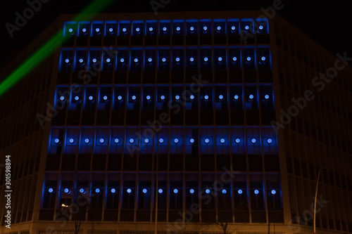 Blue dot like light show pattern on a building - Artistic view