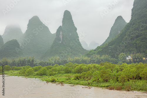 Misty hills at Maozhou island in the vicinity of Lingchuan near Guilin photo