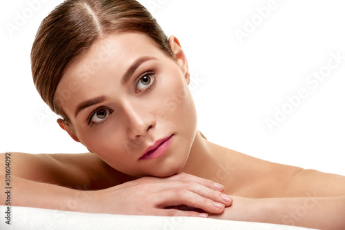 Portrait of young minded spa model with smooth soft facial skin