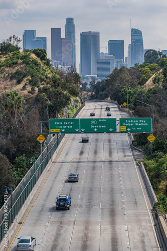 View of Los Angeles, CA with palm trees and moody sky