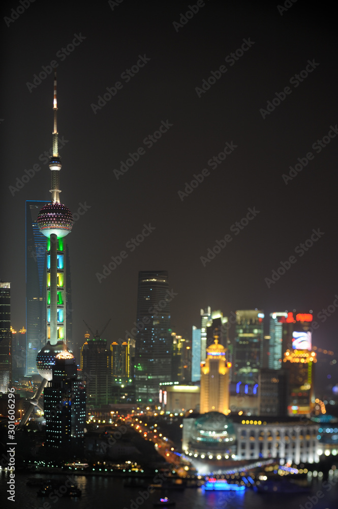 Pudong financial district by night. Only Oriental Pearl tower in focus. Shanghai, China