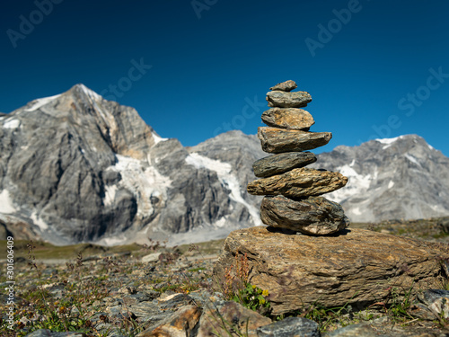 Stacked stones on Hintere Schoentaufspitze on a sunny day in summer © Stefan