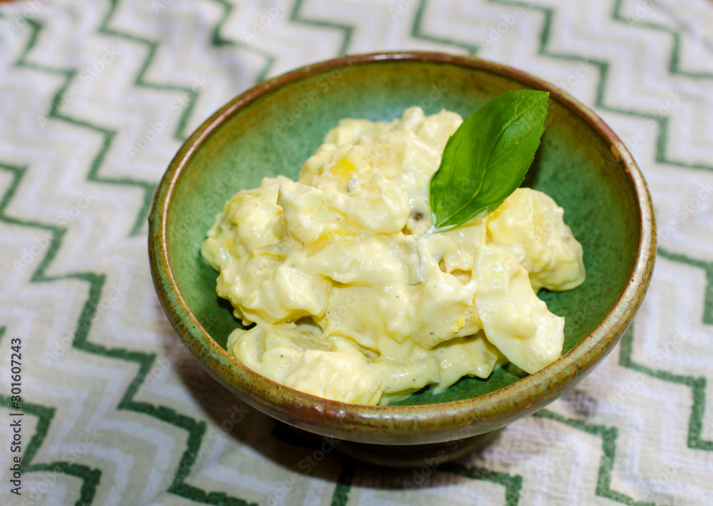 Fresh homemade potato salad. Classic American potato salad made with creamy mayonnaise dressing Fresh homemade potato salad. Classic American potato salad made with creamy mayonnaise dressing