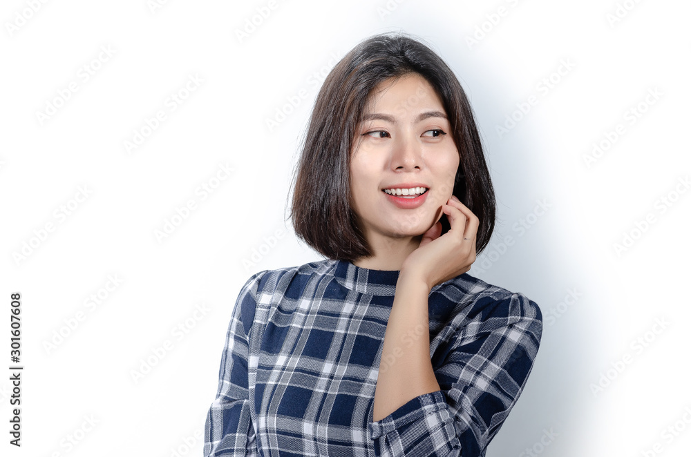 Beautiful smiling woman with clean skin, natural make-up, and white teeth on grey background Beautiful smiling woman with clean skin, natural make-up, and white teeth on grey background
