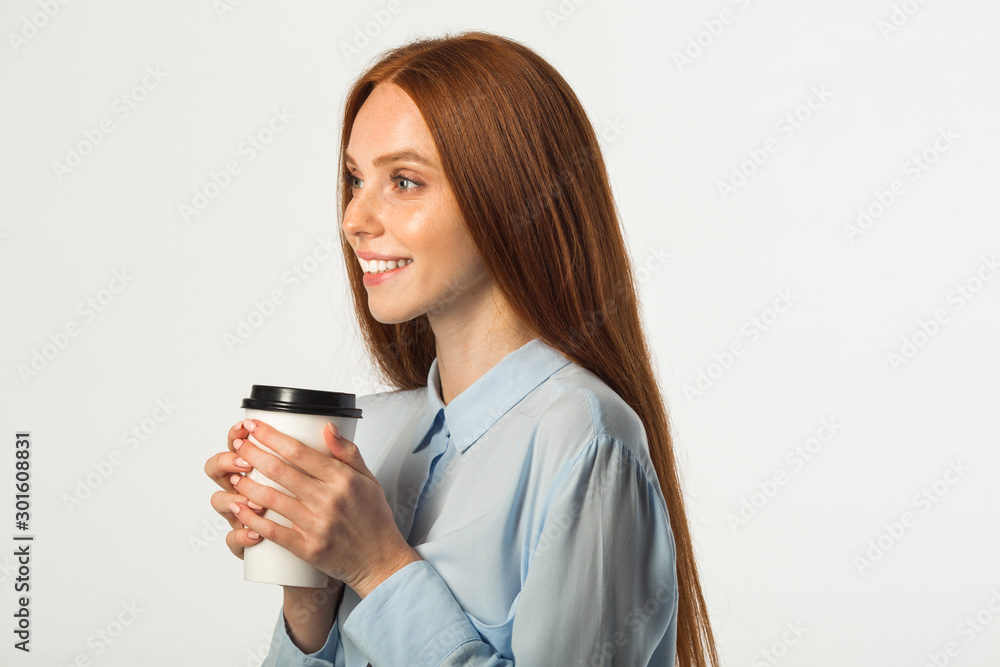 beautiful young woman with red hair with a drink in hand on a white background beautiful young woman with red hair with a drink in hand on a white background