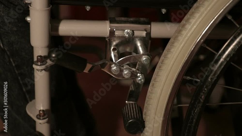 wheelchair brake. Detail of mechanism to lock the wheels