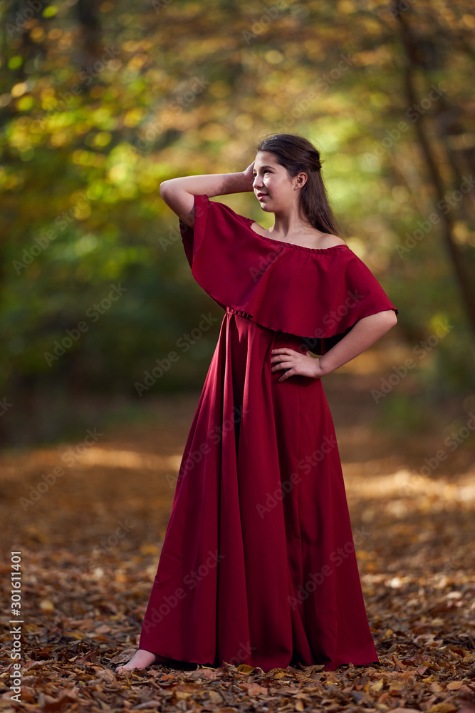 Portrait of a teenage girl in red dress Portrait of a teenage girl in red dress