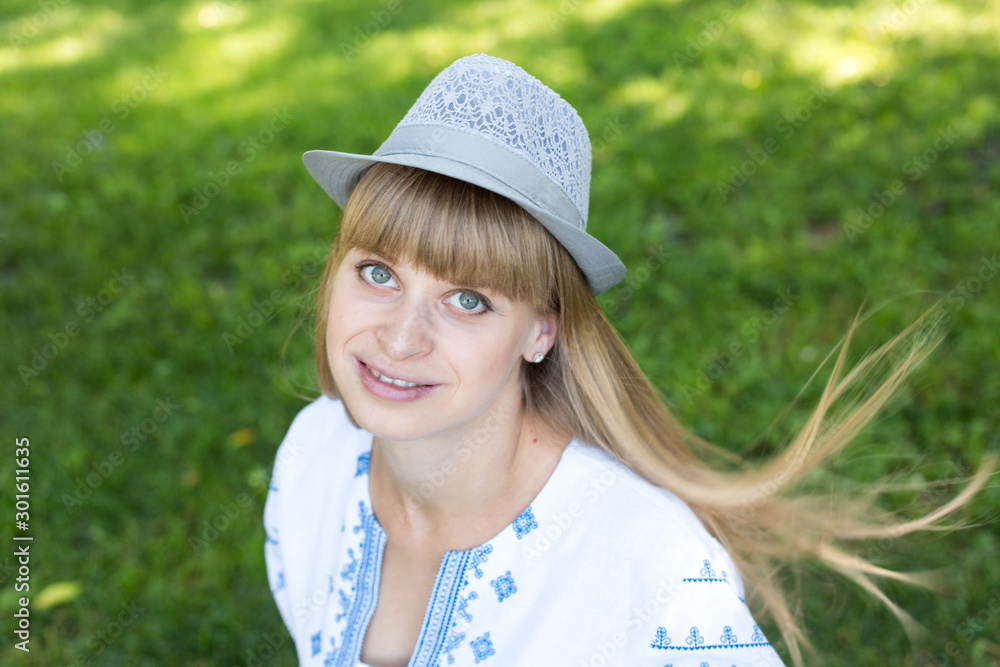 the girl in the hat embroidered shirt. national clothes of Ukraine.