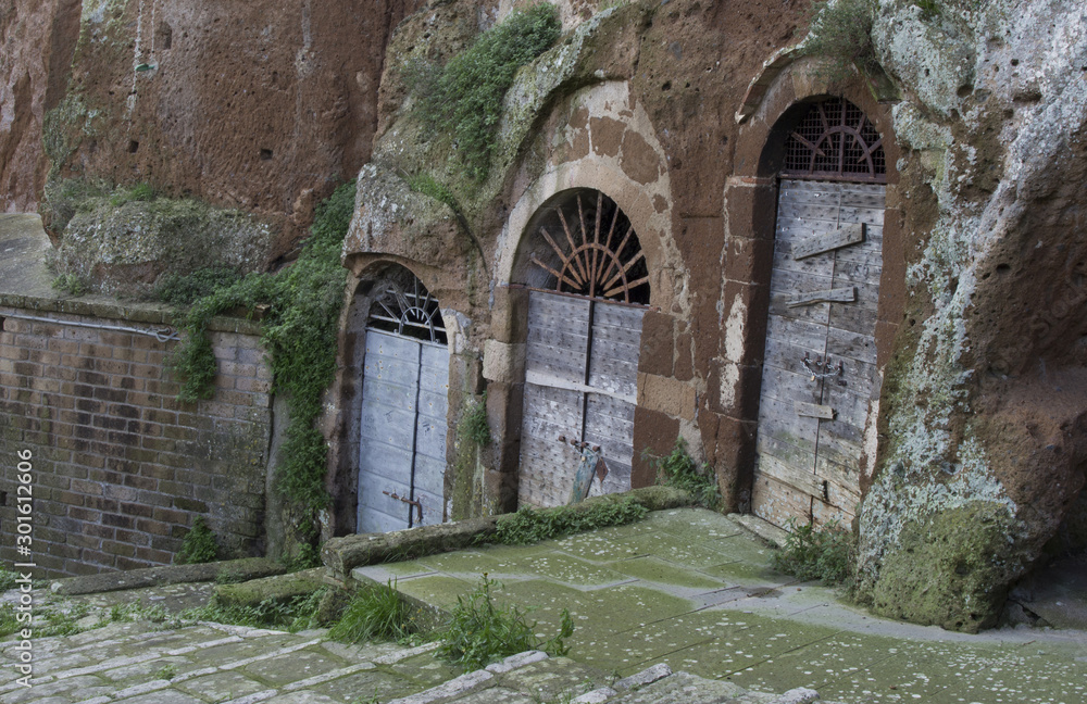 Pitigliano, one of the best town in Tuscany, Italy. Cellar doors in the medieval district. Pitigliano, one of the best town in Tuscany, Italy. Cellar doors in the medieval district.