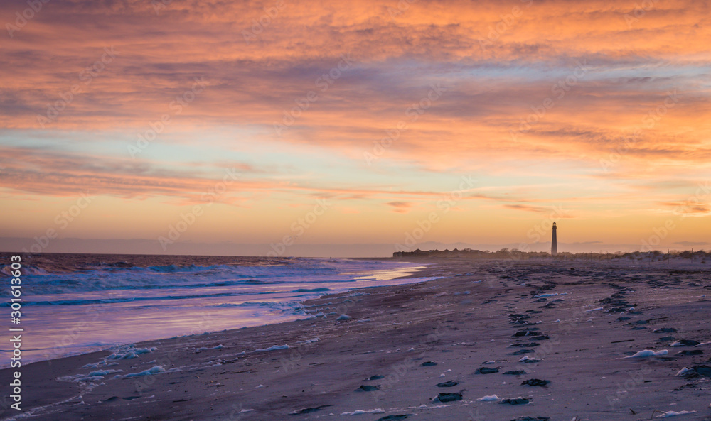 Cape May NJ lighthouse and Atlantic Ocean at sunset in springtime 