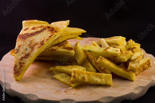 german frittatensuppe and omelette prepared and cut on a wooden cutting board photo