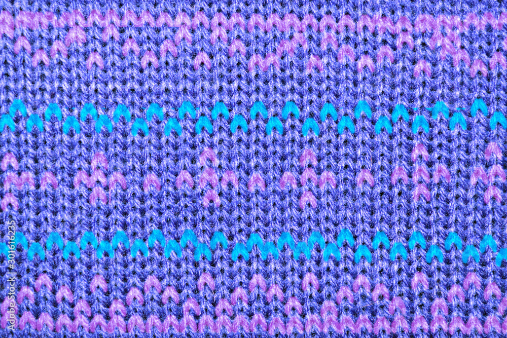 background pattern of knitted pattern of threads of different colors for winter things