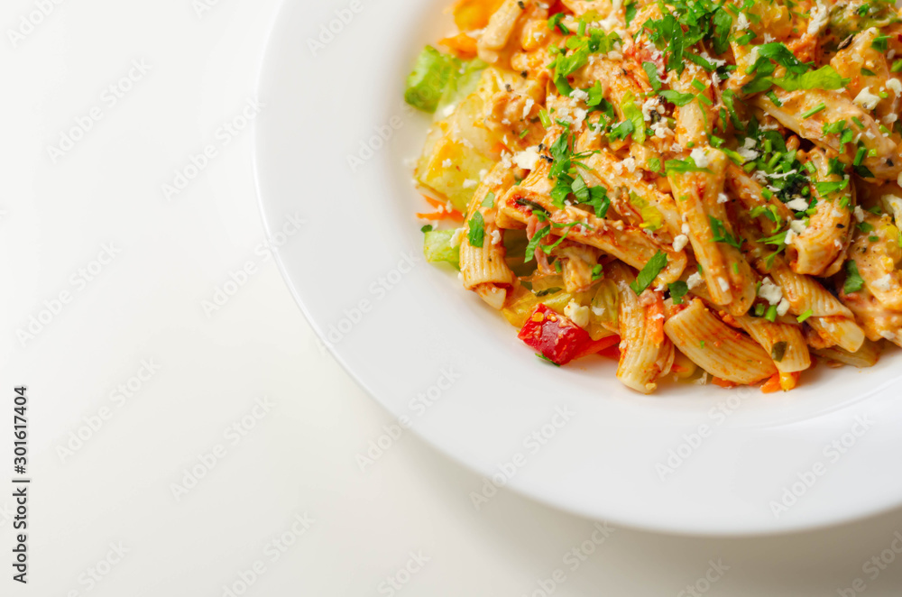 Piri piri style chicken on a bed of wholewheat pasta and vegetables, with a cool sour cream and chive dressing Piri piri style chicken on a bed of wholewheat pasta and vegetables, with a cool sour cream and chive dressing