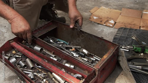 mechanic hand in the toolbox