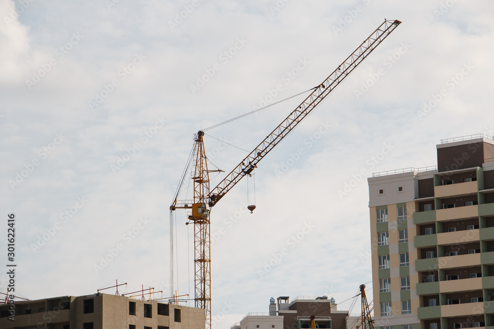 building a house neighborhood tower crane in operation building a house neighborhood tower crane in operation