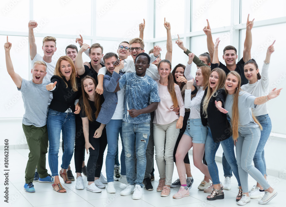 Fototapeta premium team of happy young people showing their success