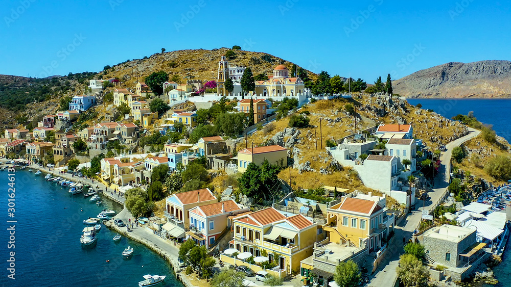 Simi island Greece view from the drone on the colorful houses and Bay of the sea with ships