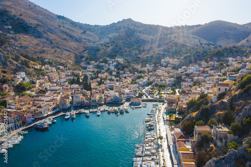 Greek island with colorful houses and Bay with Marina and boats in the Parking lot, Greece Europe