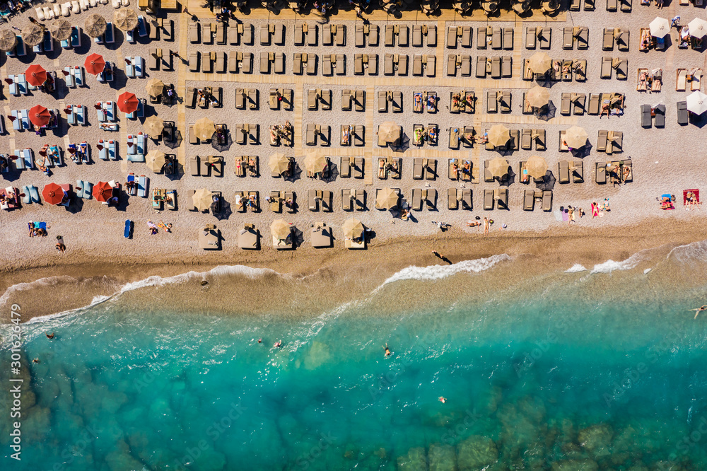 famous Ellie beach in Rhodes. sunbeds, beach, sand, waves, top view from drone. The island of Rhodes Greece