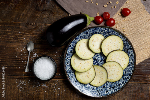 Still life of eggplants and other vegetables photo