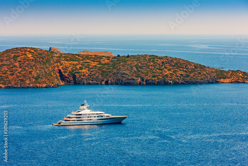 Large luxury white yacht off the coast of Crete, Greece. © photoff