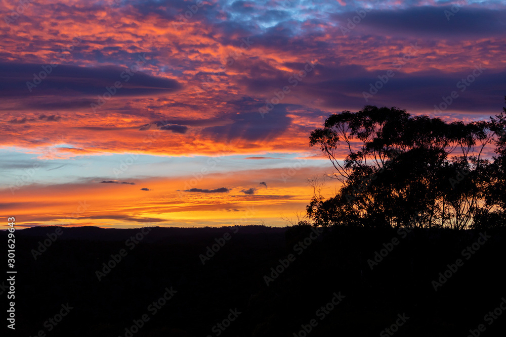 Vibrant red sunset caused by bushfire smoke in the blue mountains in australia