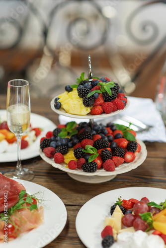 Raw fresh organic fruit and berries plate