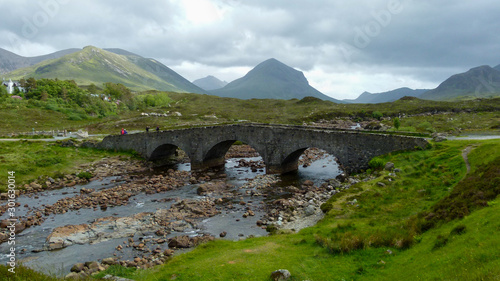 River in the mountains with an old bridge in scotland