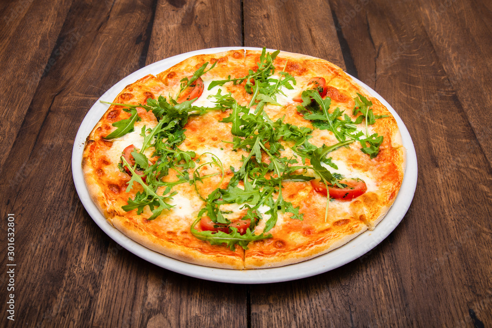 classic Italian pizza on a wooden table classic Italian pizza on a wooden table