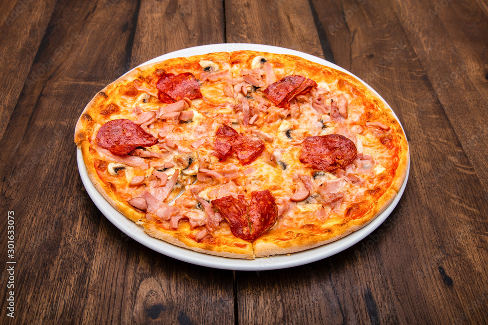 classic Italian pizza on a wooden table classic Italian pizza on a wooden table