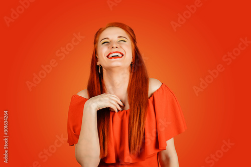 Fotografija laughing young woman with red hair has a lots of fun