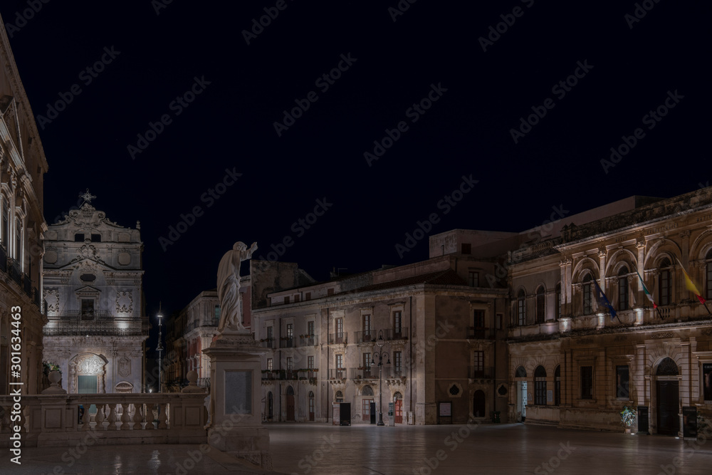 Nightscape of the central street of the Ortigia island at night, province of Siracusa, Sicily, south Italy