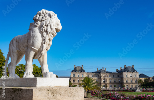 Beautiful view ornate lion statue at the Luxembourg Gardens during an autumn morning in Paris, France © Gabriel Cassan