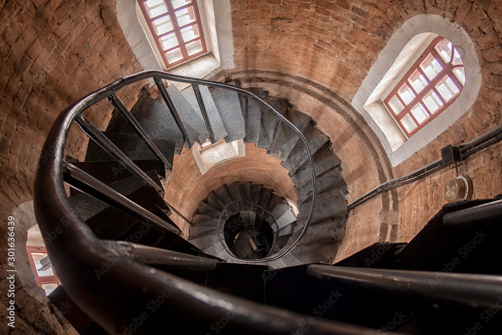 Fototapeta premium Stone steps. Old staircase leading up towards the light.